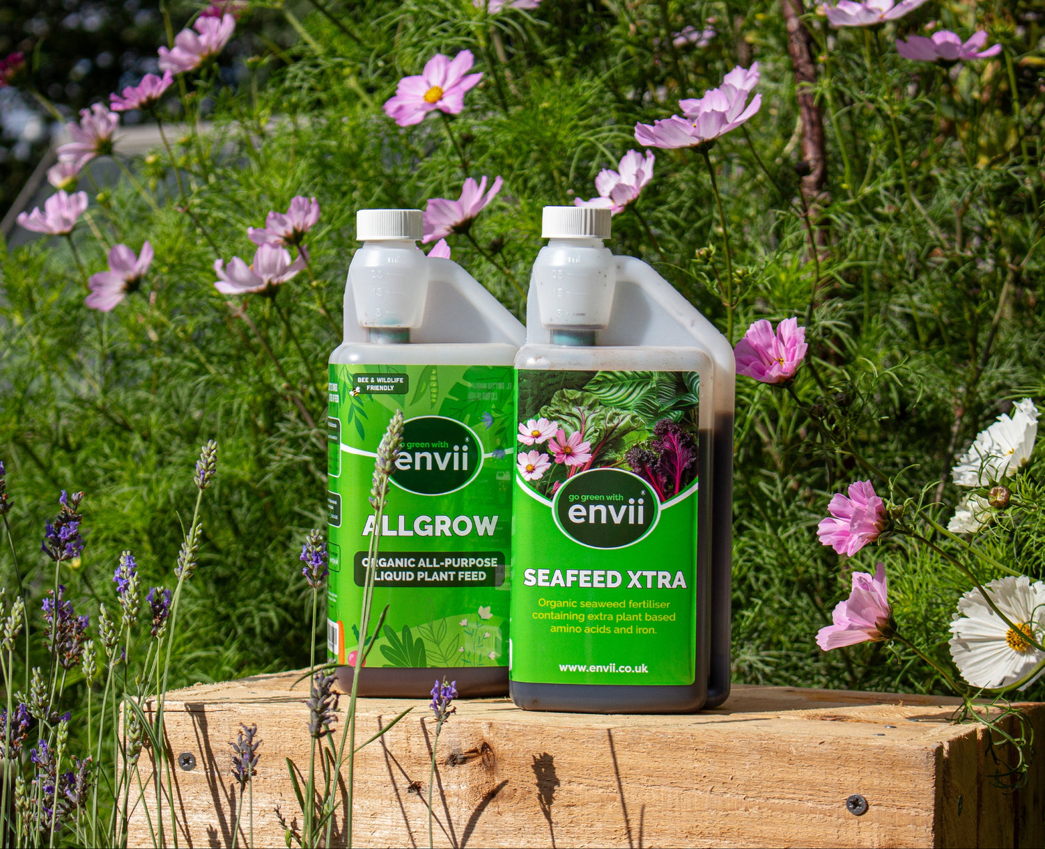 Seafeed Xtra and Allgrow amongst cosmos flowers.